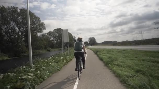 Woman Cycling Road Typical Dutch Village Countryside Bicycle Lane Road — Stockvideo