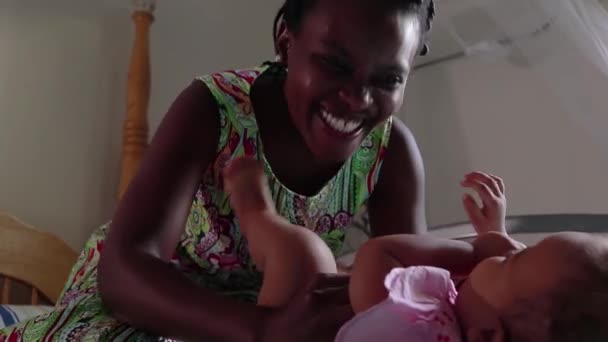 Close African Mother Laughing Playing Her Baby Daughter — Stock Video