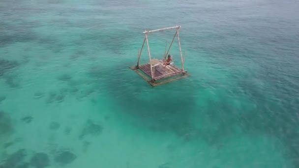 Aerial Tracking View Young Caucasian Woman Bikini Sitting Alone Swing — Stock Video