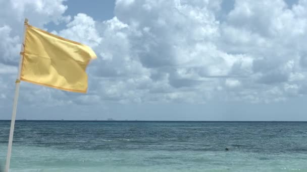 Yellow Flag Blowing Wind View Ocean Cloudy Sky — kuvapankkivideo