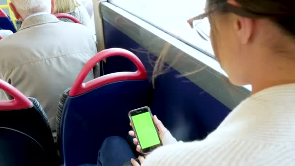 Young Woman Checks Her Phone Bus — Stock video