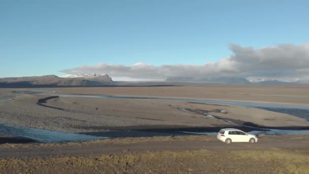 Cinematic Flyover Shot Car Parked Glacial River — Stockvideo