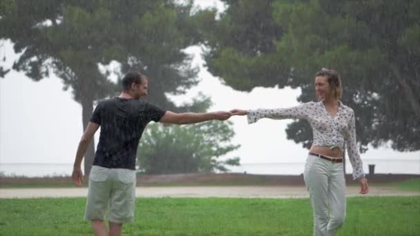 Romantic Couple Joyfully Dancing Each Other Pouring Rain Park Slow — Wideo stockowe