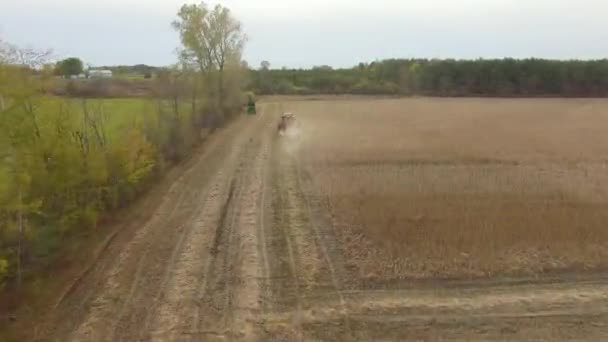 Drone Fly Trees Revealing Farm Land Machines Working Harvesting Season — Stock Video