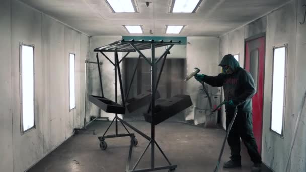 Man Applying Black Corrosion Powder Coating Metal Sheet Using Spray — 图库视频影像