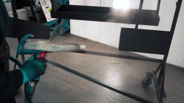Man Applying Black Corrosion Powder Coating Metal Sheet Using Spray — Stock video