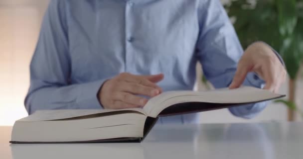 Man Opens Book — Stockvideo