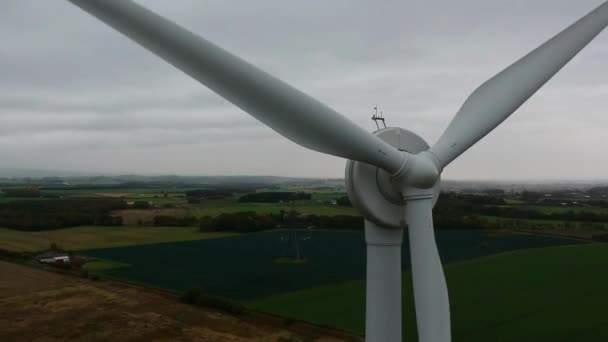 Slow Descending Shot Front Rotating Wind Turbine Countryside Background — Stock videók