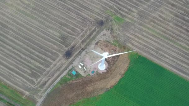 Overhead Slow Descent Wind Turbine Ploughed Field — Stockvideo