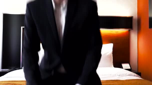 Tired Male Business Traveler Sitting Falling Hotel Bed – Stock-video