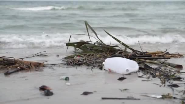 Plastic Bottle Waste Left Beach Sand Polluting Sea — Stock video
