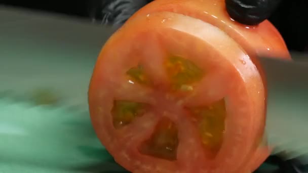 Close Gloved Hands Cutting Tomato Slices — Videoclip de stoc