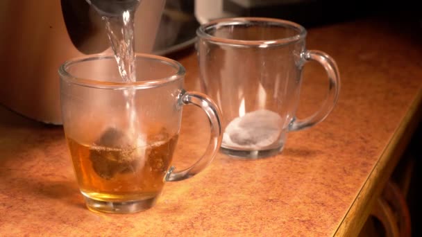 Pouring Boiling Hot Water Tea Bags See Teacups — Vídeos de Stock