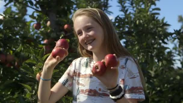 Young Teen Girl Orchard Poses Fresh Picked Red Apples — Video Stock
