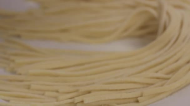 Closeup Freshly Cut Pasta Noodles Placed Plate Cooking — Stockvideo