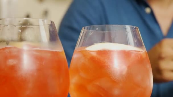 Close Two Refreshing Fruity Drinks Server Adds Straws Serving — Videoclip de stoc