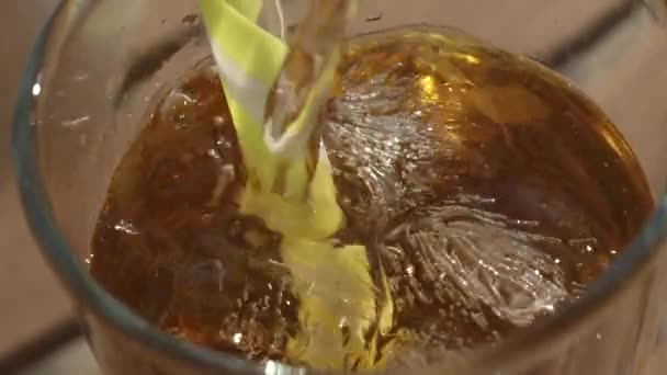 Close Liquid Being Poured Glass Ice Cubes Yellow Straw High — Vídeos de Stock