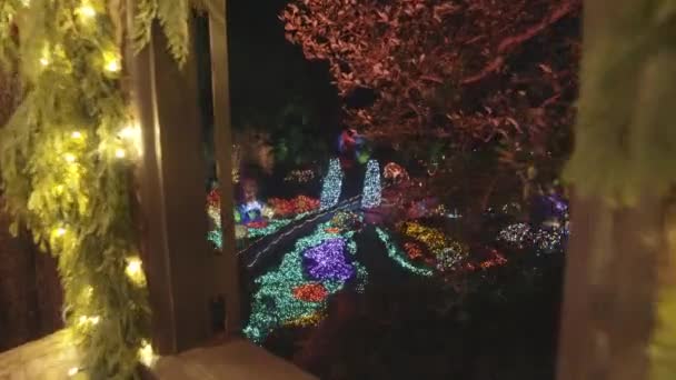 Christmas Lights Decorated Garden View Cabin Window — Vídeos de Stock
