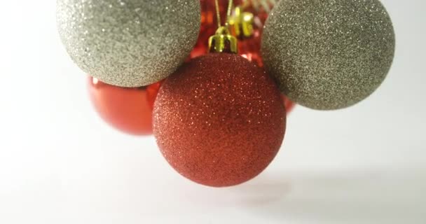 Group Christmas Baubles Dangling Rotating Viewed Slow Motion Neutral Background — Stock Video