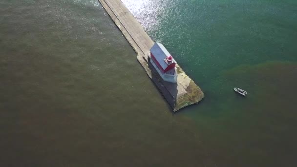 Aerial View Lighthouse Beacon Pier Michigan Usa Small Boat Drone — Stockvideo