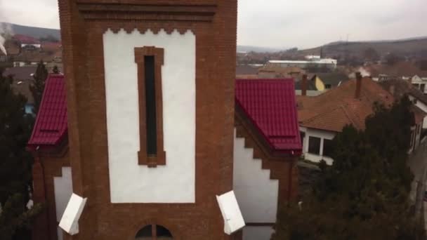 Aerial Drone Close Fly Red Roofed Church Small Community City — kuvapankkivideo