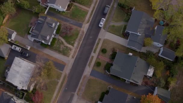 Drone Camera Spins Descends Autumn Suburban Street — ストック動画
