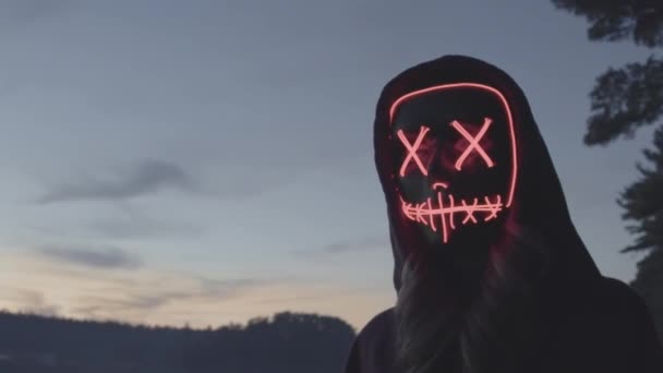 Close Mysterious Girl Wearing Red Glow Halloween Mask Dusk River — Stock video