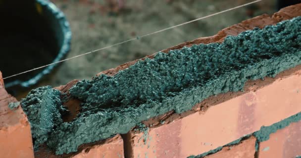 Asian Man Spreading Mortar Laying Bricks Build Wall — Stock Video