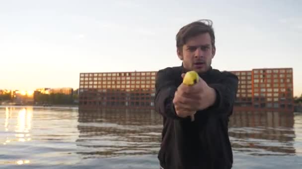 Video Man Pretending Shoot Banana Gun Pier — Stock Video