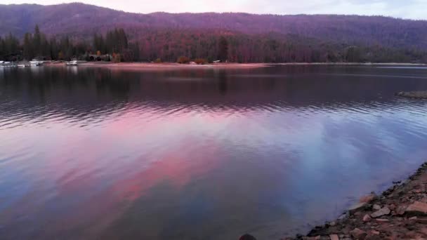 Aerial Shot Girl Reading Rock Lake Sunset — Stock videók