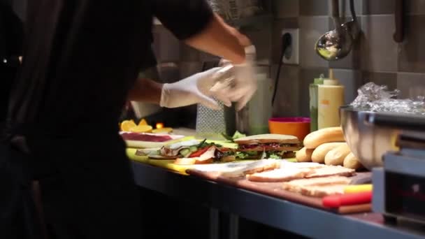 Caterer Putting Pepper Sandwich — Vídeos de Stock