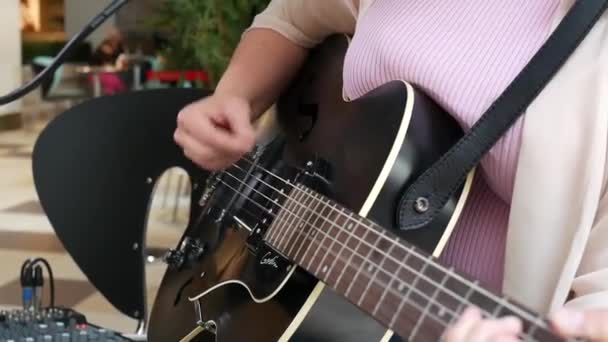 Close Female Musician Strumming Guitar — Stock Video