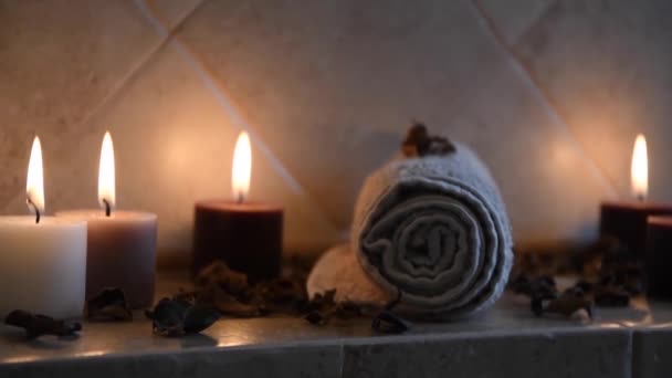 Relaxing Spa Background Candles Flickering Flame Some Wooden Petals Towel — Vídeo de stock