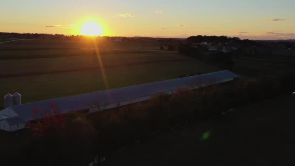 Moody Aerial Shot Farmland Going Beaming Sunset Creates Lens Flare — Stok video