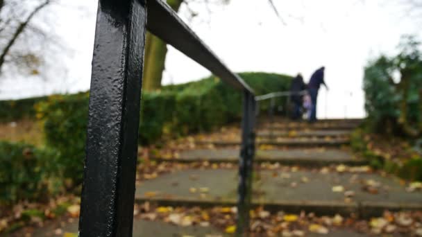 Panning Low Shot Wrought Iron Hand Rail Sturred People Walk — Stock video