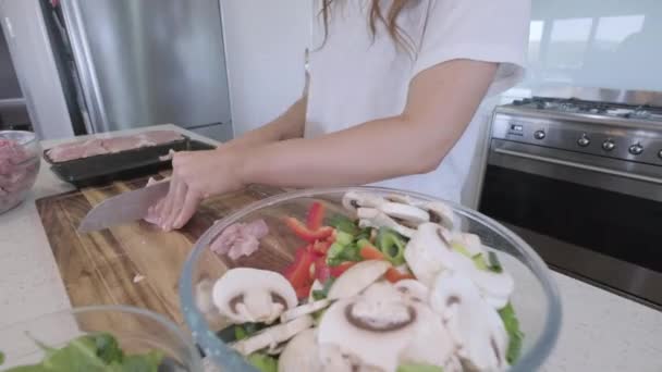 Side Wide Angle Sliding Shot Woman Preparing Chicken Vegetables Asian — стоковое видео