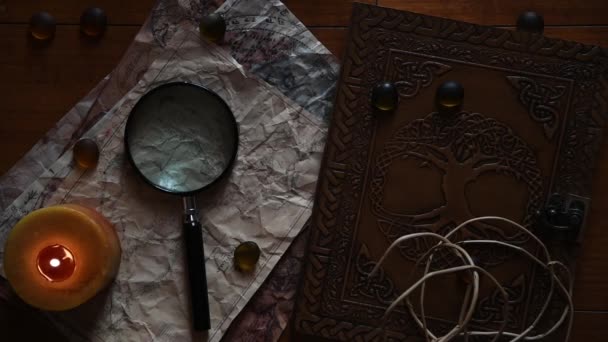 Beautiful Vintage Background Ancient Maps Book Candle Some Stones Magnifying — Stock Video