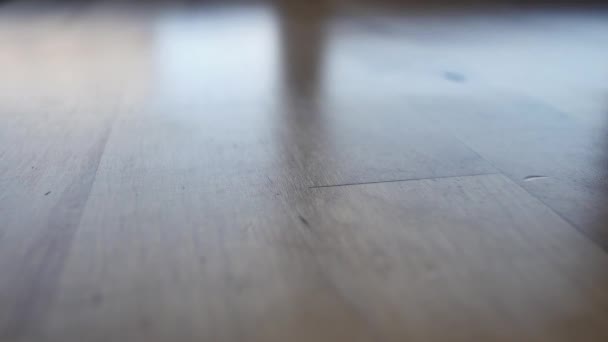 Transparent Blue Sunglasses Being Set Light Wood Table — Wideo stockowe