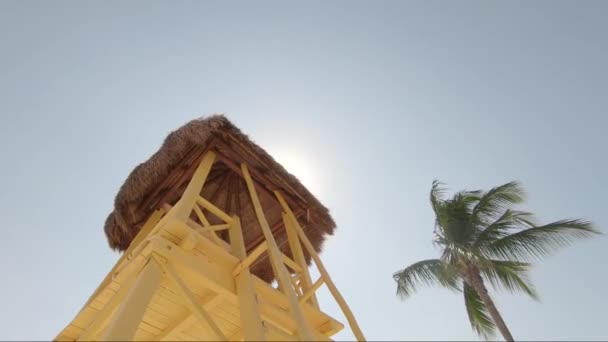 Bright Yellow Watch Tower Tropical Beach — Stock video
