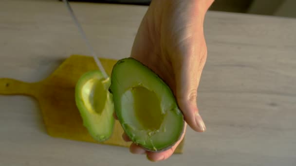 Female Cutting Avocado Slow Motion Young White Woman Preparing Avocado — Stok video