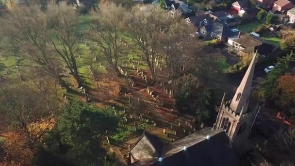 Slow Pan Shot English Church Steeple Cemetery Autumn Colours Trees — Vídeos de Stock