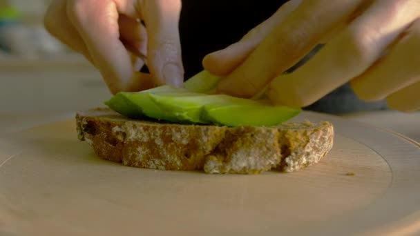 Close Young Woman Putting Avocado Buckwheat Bread White Female Preparing — Stock video