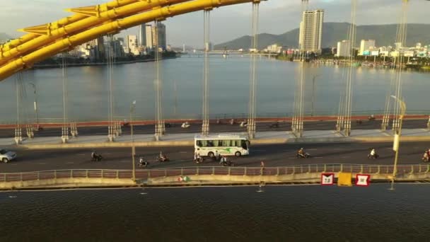 Tracking Aerial Shot Bus Motorbikes Crossing Famous Dragon Bridge Danang — ストック動画