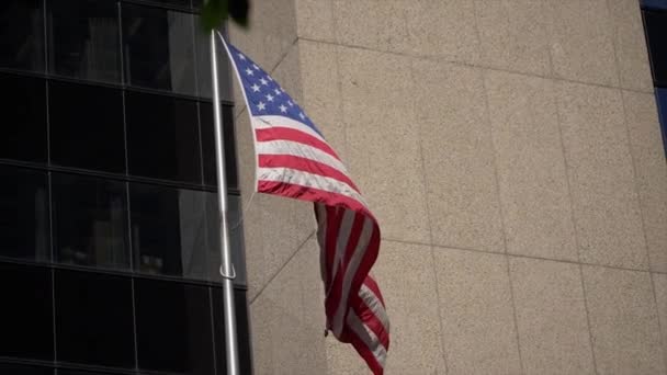American Flag Waving Mast Building Backgound Slow Motion Shot — стокове відео
