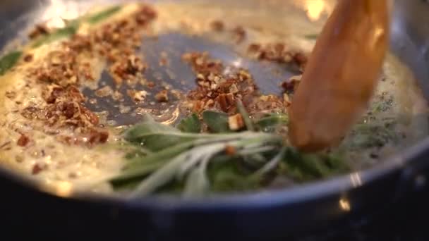 Stirring Butter Sage Sauce Pan — стоковое видео