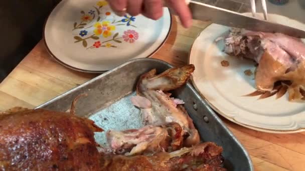 Male Carving Roasted Turkey Putting Pieces Plates — Stockvideo