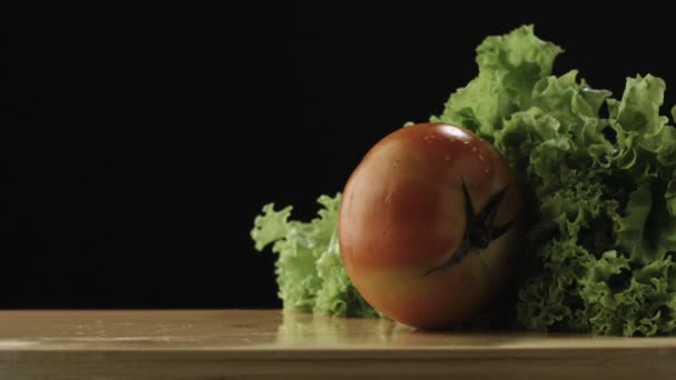 Slow Motion Tomato Hitting Lettuce — Stockvideo