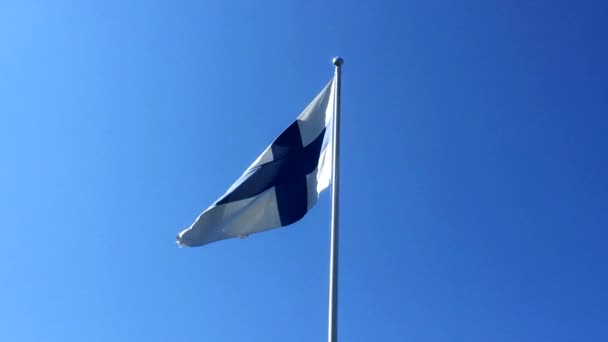 Flag Finland Waving Slow Motion Clear Blue Sky Background — ストック動画