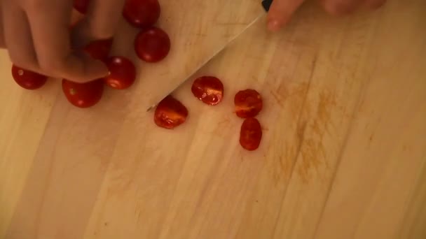 Female Hand Cutting Tiny Juicy Tomatoes Light Wooden Chopping Board — Stok video