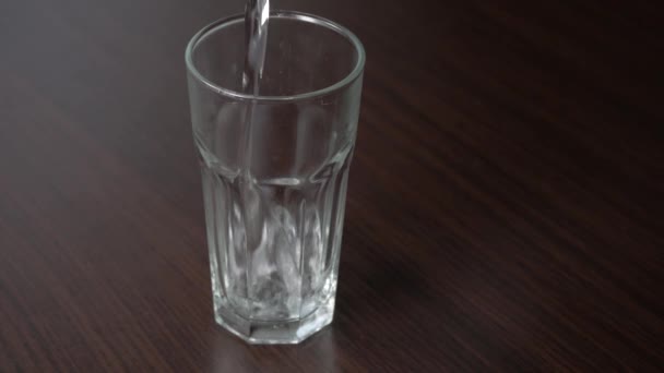 Pouring Still Water Tall Glass Wooden Table — Vídeos de Stock